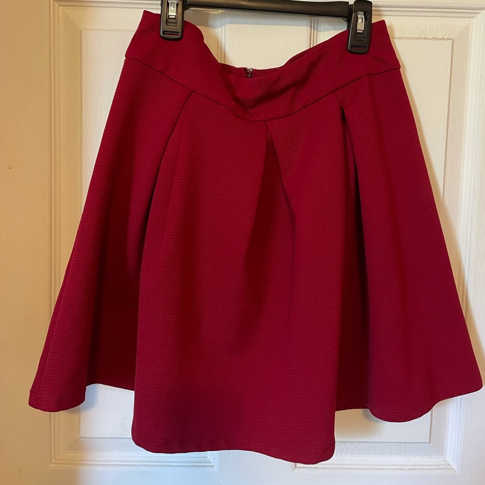 Red pleated mini skirt